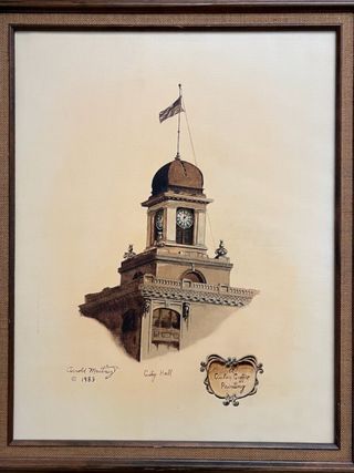 Painting of the top of Tampa City Hall in shades of brown. Signed Arnold Martinez 1983. A small banner in bottom corner says