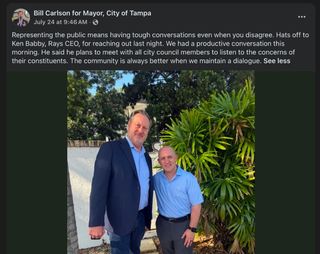 Carlson, who is much taller than Rays CEO Ken Babby, the short bald guy in the photo. Text reads: Representing the public means having tough conversations even when you disagree. Hats off to Ken Babby, Rays CEO, for reaching out last night. We had a productive conversation this morning. He said he plans to meet with all city council members to listen to the concerns of their constituents. The community is always better when we maintain a dialogue.