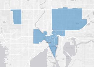 Gray scale map of Tampa with CRA districts shaded blue.